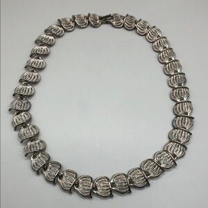 Vintage silver tone metal links collar necklace signed HJ costume jewelry.
